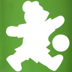 Silhouette of a teddy bear playing with soccer ball