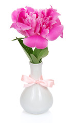 Pink peony in vase decorated with ribbon