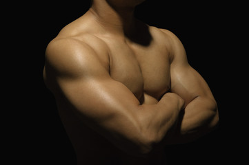 Close-up of a muscular man showing his muscles