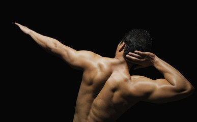 Fototapeta na wymiar Rear view of a man exercising