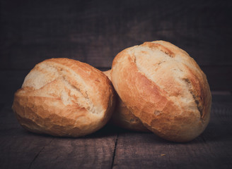 Wheat bread roll on a cutting board