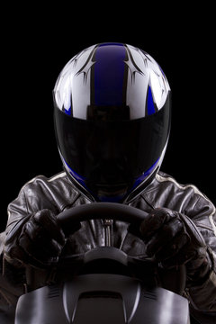 Race Car Driver Wearing Protective Leather And Helmet
