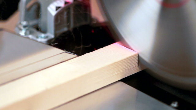 Miter saw cutting wood