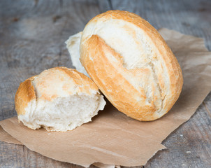 Rolls on the background of the wooden table 