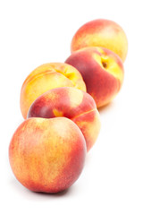 Ripe peaches fruits isolated on white