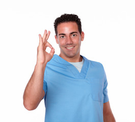 Fototapeta premium Latin nurse man with postive sign