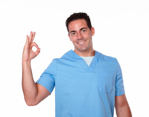 Naklejka premium Charming nurse guy with ok sign