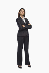 Obraz premium Portrait of a businesswoman standing with her arms crossed