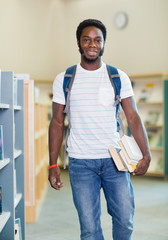 Student With Backpack And Books In Bookstore