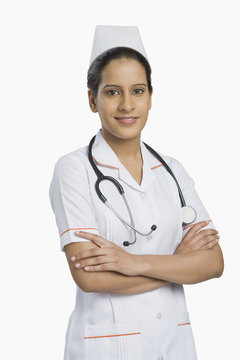 Female nurse standing and smiling