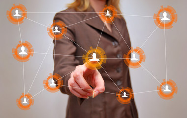 Businesswoman in front of visual touch screen.