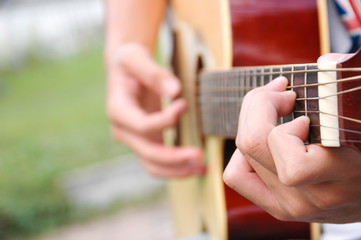 Hands play guitar