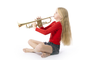 young girl in red playing trumpet © ahavelaar