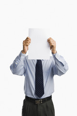 Businessman showing a sheet of blank paper