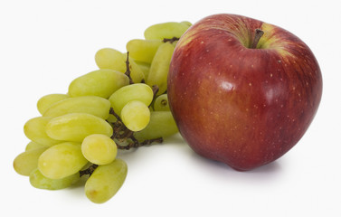 Close-up of a bunch of grapes with an apple