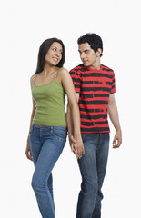 Couple looking at each other with holding hands