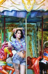 Obraz na płótnie Canvas Amusement Park. Attractive Woman in Fanfair on Arcade