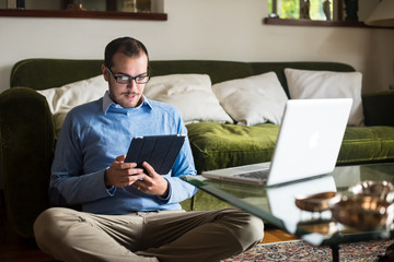 elegant business multitasking multimedia man at home