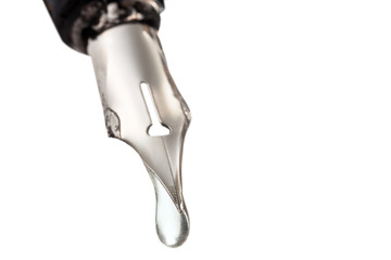 liquid drop dripping from nib of pen close up