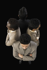 High angle view of four businessmen standing with arms crossed