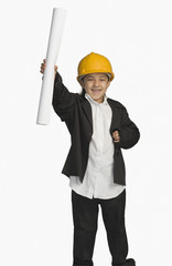 Girl dressed as an architect and holding a blueprint