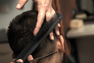 Men's haircut at the barber scissors