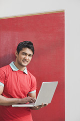 Portrait of a man using a laptop