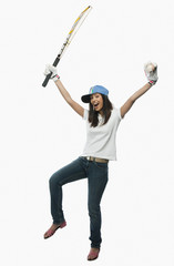 Portrait of a female cricket fan cheering