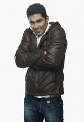 Fototapeta premium Portrait of a man smiling with arms crossed