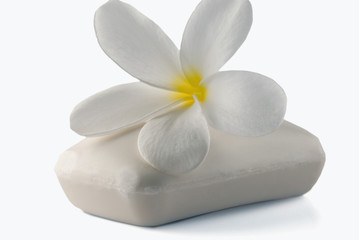 Close-up of Frangipani flower with a bar of soap