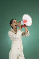 Businesswoman announcing with a megaphone