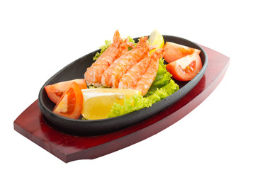 fried shrimp with vegetables on plate isolated
