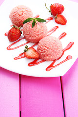 Delicious ice cream on plate on table close-up