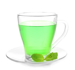 Transparent cup of green tea with mint isolated on white