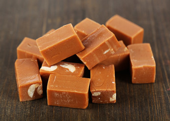 Many toffee on wooden table