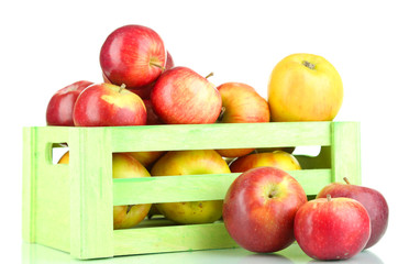 Juicy apples in wooden box isolated on white