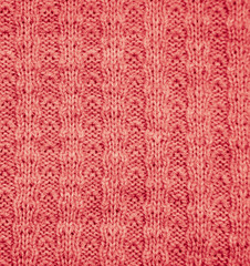 Fototapeta premium red knitted fabric as a background. macro