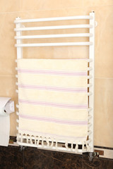 Color towel on  radiator in bathroom