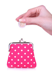 Pink purse and coin in female hand isolated on white