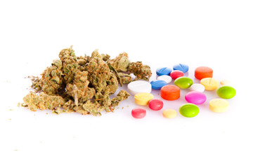 marihuana and pills isolated on white background