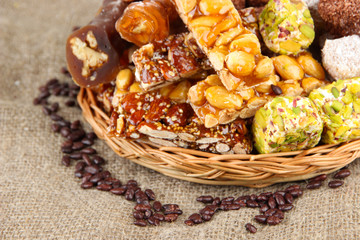 Tasty oriental sweets, on burlap background