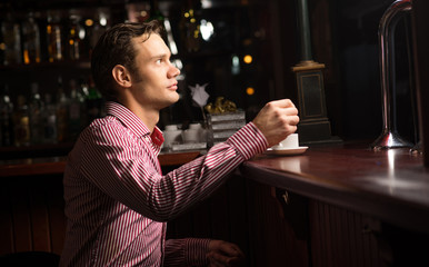 man with a cup of coffee
