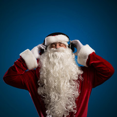 Santa Claus is listening to music