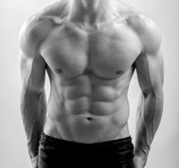 Close up on perfect abs. Strong bodybuilder with six pack