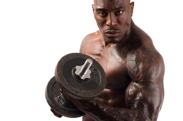 Black bodybuilder training with heavy dumbbell