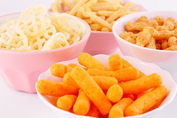 Potato, corn and wheat chips in bowls