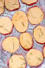 sweet potato with rosemary on the foil