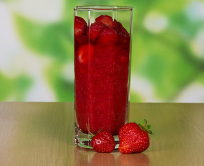 Ripe strawberry in a glass