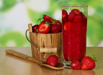 Strawberry in wooden bucket and glass