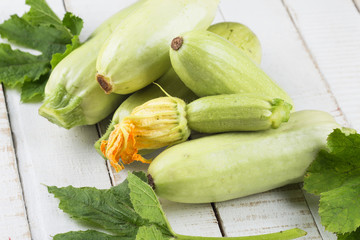 Fresh marrow on wooden table